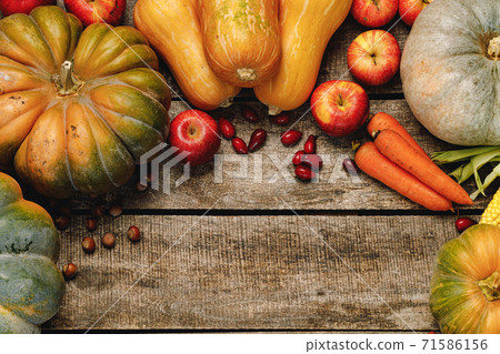 Beautiful composition with autumn vegetables on weathered wooden background Beautiful composition with autumn vegetables on weathered wooden background 71586156
