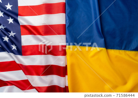 Flags of Ukraine and Usa folded together Flags of Ukraine and Usa folded together 71586444