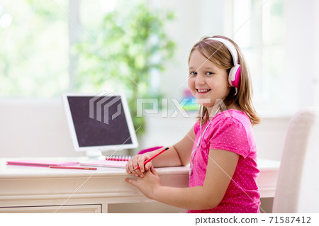 Online remote learning. School kids with computer. Online remote learning. School kids with computer. 71587412