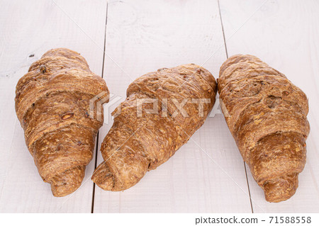 Baked croissant on white wood 71588558