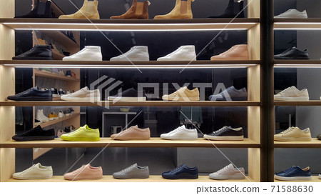 Unbranded footwear on display in a shop window 71588630