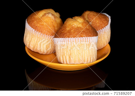 Baked muffin on black glass 71589207