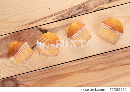 Baked muffin on wood Baked muffin on wood 71589311