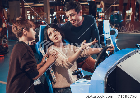 Woman makes excuses why she lost in a video game. Woman makes excuses why she lost in a video game. 71590756