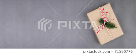 Kraft gift box on cement floor background in Christmas day or holiday, present box on desk. Kraft gift box on cement floor background in Christmas day or holiday, present box on desk. 71590776