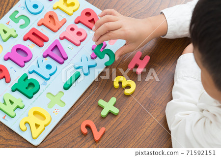 Toddler studying math Toddler studying math 71592151