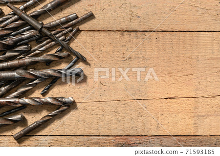 old vintage hand tools - set of drills on a wooden background with blank space for text 71593185