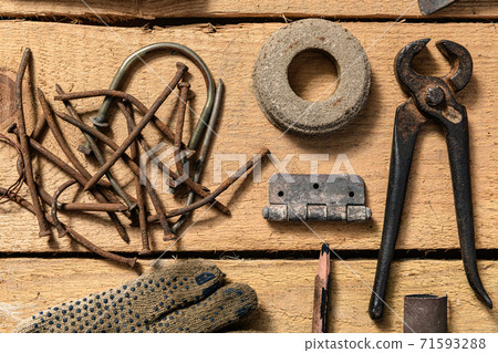 Old vintage household hand tools still life on a wooden background in a DIY and repair concept 71593288