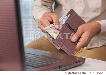 Close up of man hand counting 100 us dollar cash  71593564