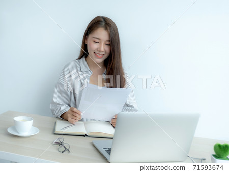 Young Asian teachers are teaching fun online from their home office, social distancing teaching concept during COVID virus diseases Young Asian teachers are teaching fun online from their home office, social distancing teaching concept during COVID virus diseases 71593674