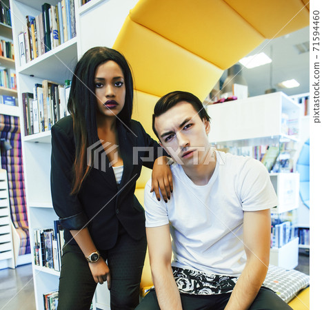 couple students in univercity library, looking book, preparing to exam, having fun, making selfie, lifestyle people concept 71594460