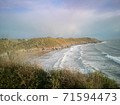 Approaching high-tide at Caswell Bay Beach in Wales, UK. 71594473