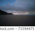 Stormy Skies with torrential downpour out at sea at Caswell Bay in Gower, Wales, UK. Rain on the beach in late Autumn. 71594475