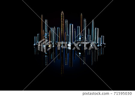 Night city of screws, bolts and nuts with reflection on a black background. The idea of advertising photos of fasteners Night city of screws, bolts and nuts with reflection on a black background. The idea of advertising photos of fasteners 71595030