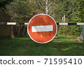 Stop traffic sign on the barrier 71595410