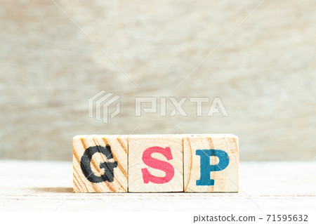 Alphabet letter in word GSP (Abbreviation of Good Storage Practice or Generalized System of Preferences or Gross State Product) on wood background 71595632