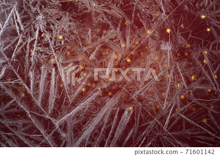 White freeze, ice crystal texture on red background with bokeh. White freeze, ice crystal texture on red background with bokeh. 71601142