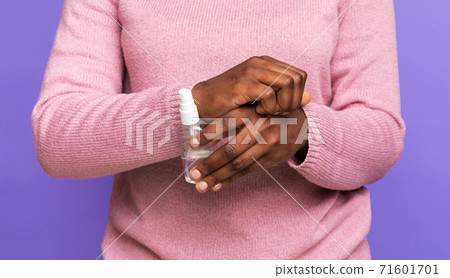 Black Woman Scratching Irritated Skin With Eczema And Holding Bottle With Disinfectant Black Woman Scratching Irritated Skin With Eczema And Holding Bottle With Disinfectant 71601701