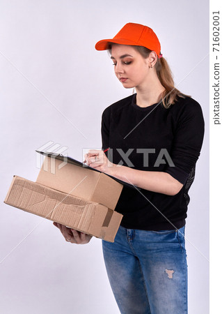Female courier delivers boxes. Female courier delivers boxes. 71602001