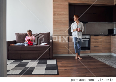 Mom standing in the kitchen 71602618