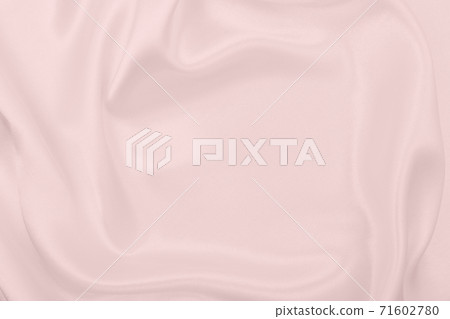 Smooth elegant pink silk or satin texture as wedding background. Luxurious background design Smooth elegant pink silk or satin texture as wedding background. Luxurious background design 71602780
