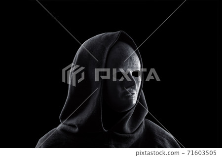 Portrait of a scary figure in hooded cloak isolated on black 71603505