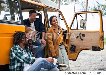 Friends talking near the car Friends talking near the car 71604859