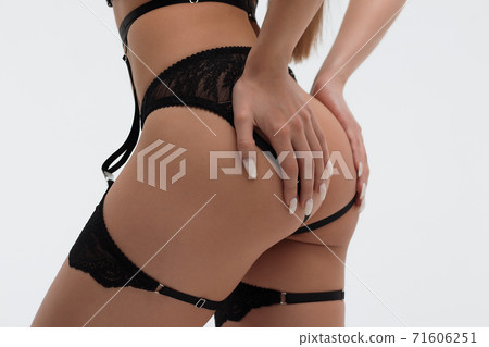 Faceless sexy woman with hands on buttocks 71606251