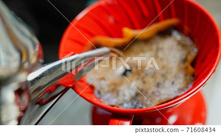 Photo of pouring hot water to make coffee Photo of pouring hot water to make coffee 71608434
