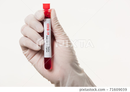 Doctor scientist in white uniform wear a mask holding test tube Coronavirus Doctor scientist in white uniform wear a mask holding test tube Coronavirus 71609039