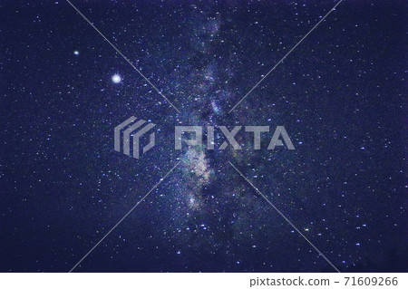 A starry sky over the night sky of Taketomi Island - Stock Photo