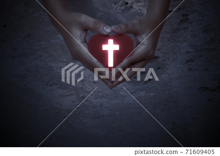 Human hands showing red heart with Christian cross Human hands showing red heart with Christian cross 71609405