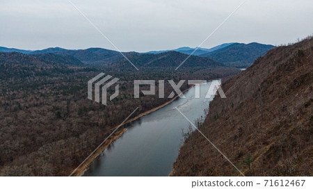 Valley Of The Mountain River Anyuy. Khabarovsk territory in the far East of Russia. The view of Anyui river is beautiful. Anyu national Park. Landscape mountain river in the Russian taiga. Valley Of The Mountain River Anyuy. Khabarovsk territory in the far East of Russia. The view of Anyui river is beautiful. Anyu national Park. Landscape mountain river in the Russian taiga. 71612467