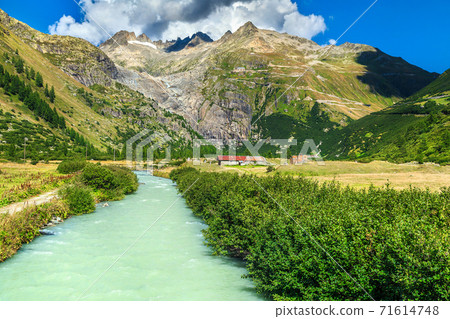 Summer alpine landscape with curved road, Furka Pass, Switzerland, Europe 71614748