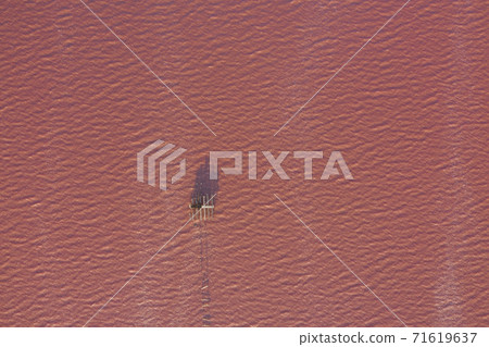 High angle drone view of pink lake where salt is extracted High angle drone view of pink lake where salt is extracted 71619637