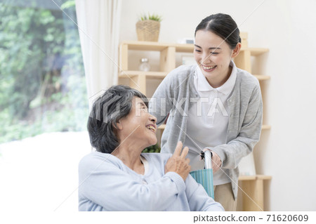 Young female caregiver talking Young female caregiver talking 71620609
