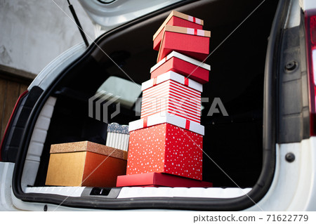 pile of Christmas gift boxes in car pile of Christmas gift boxes in car 71622779