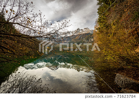 Lake Tovel and Brenta Dolomites in Autumn - Trentino-Alto Adige Italy 71623784
