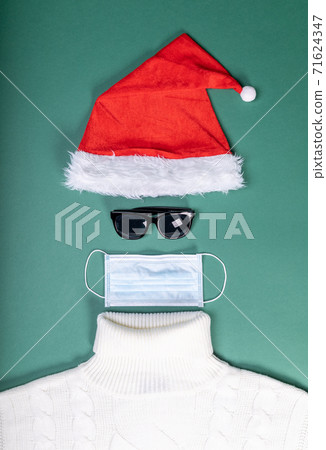 red hat mask and white sweater flat lay shape of Santa Slaus red hat mask and white sweater flat lay shape of Santa Slaus 71624347