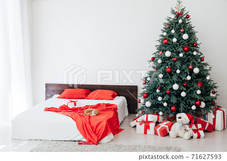 Christmas tree with gift decor bedroom with bed new year feast winter background Christmas tree with gift decor bedroom with bed new year feast winter background 71627593