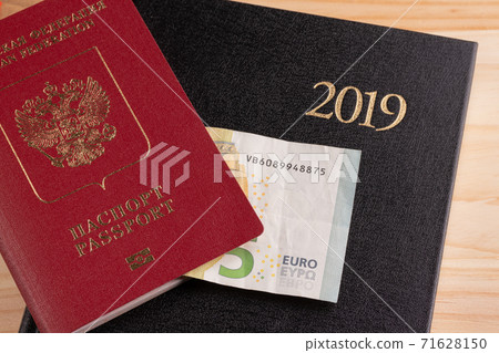 Travel and tourist packages - Russian passport, euro, notebook for planning vacation and travel Travel and tourist packages - Russian passport, euro, notebook for planning vacation and travel 71628150