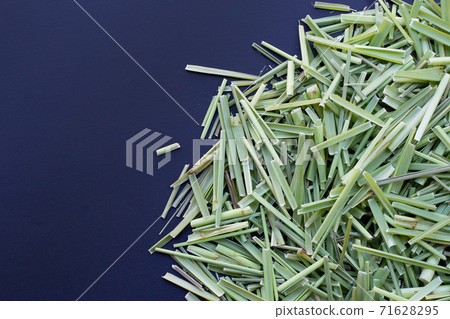 Organic lemongrass on dark background. 71628295