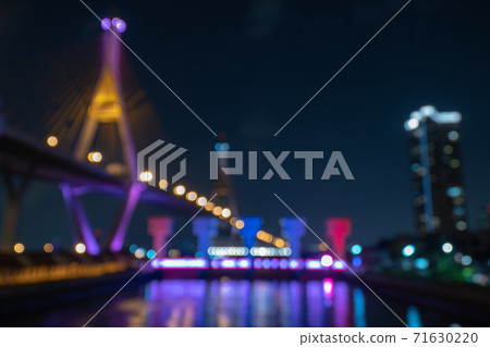 Abstract blur defocus bokeh background of Bhumibol Bridge light or Illuminate at night. City life Abstract blur defocus bokeh background of Bhumibol Bridge light or Illuminate at night. City life 71630220