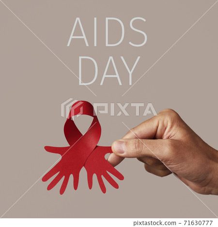 man holding a red ribbon and text aids day 71630777