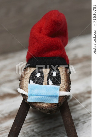 catalan tio de nadal wearing a face mask 71630783