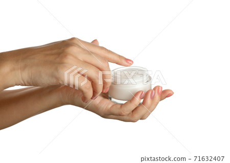 Female hands hold jar with cosmetic cream, isolated on white background Female hands hold jar with cosmetic cream, isolated on white background 71632407