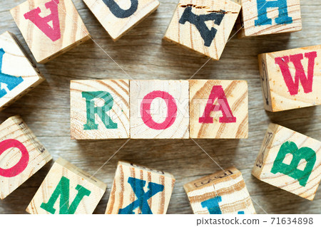 Alphabet letter block in word ROA (Abbbreviation of Return on assets) with another on wood background Alphabet letter block in word ROA (Abbbreviation of Return on assets) with another on wood background 71634898