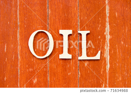Alphabet letter in word oil on old red color wood plate background Alphabet letter in word oil on old red color wood plate background 71634988