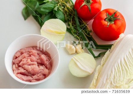 Cooking cabbage rolls with chicken mince for a dish at home Cooking cabbage rolls with chicken mince for a dish at home 71635639