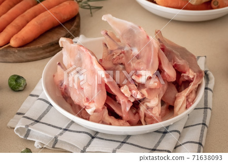 Fresh chicken skeletons with meat and vegetables - ingredients to prepare bone broth Fresh chicken skeletons with meat and vegetables - ingredients to prepare bone broth 71638093